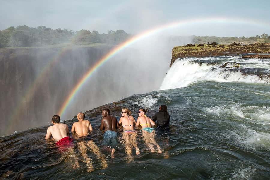 From Victoria Falls: Livingstone Island Tour & Devils Pool - The Royal Livingstone briefing and boat ride