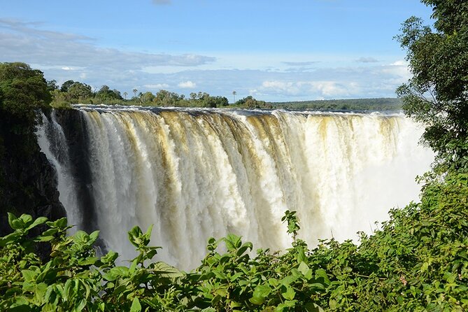 Guided Tour Of The Majestic Victoria Falls/Sunrise Tour - Livingstone Island, Devil’s Pool, and the border bridge