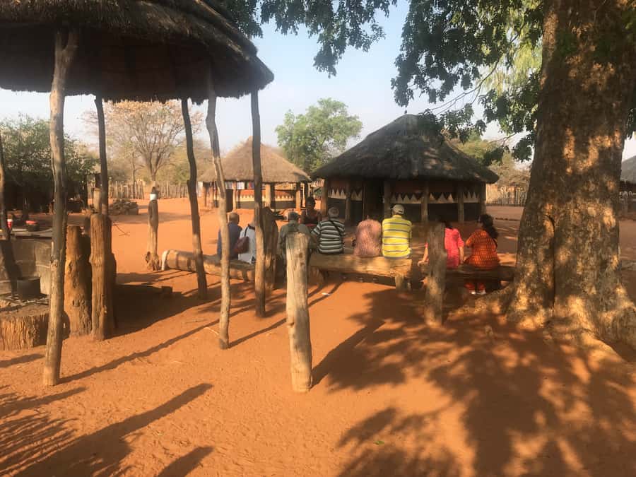 Victoria Falls: Village Life Experience - Stamping maize and taking part